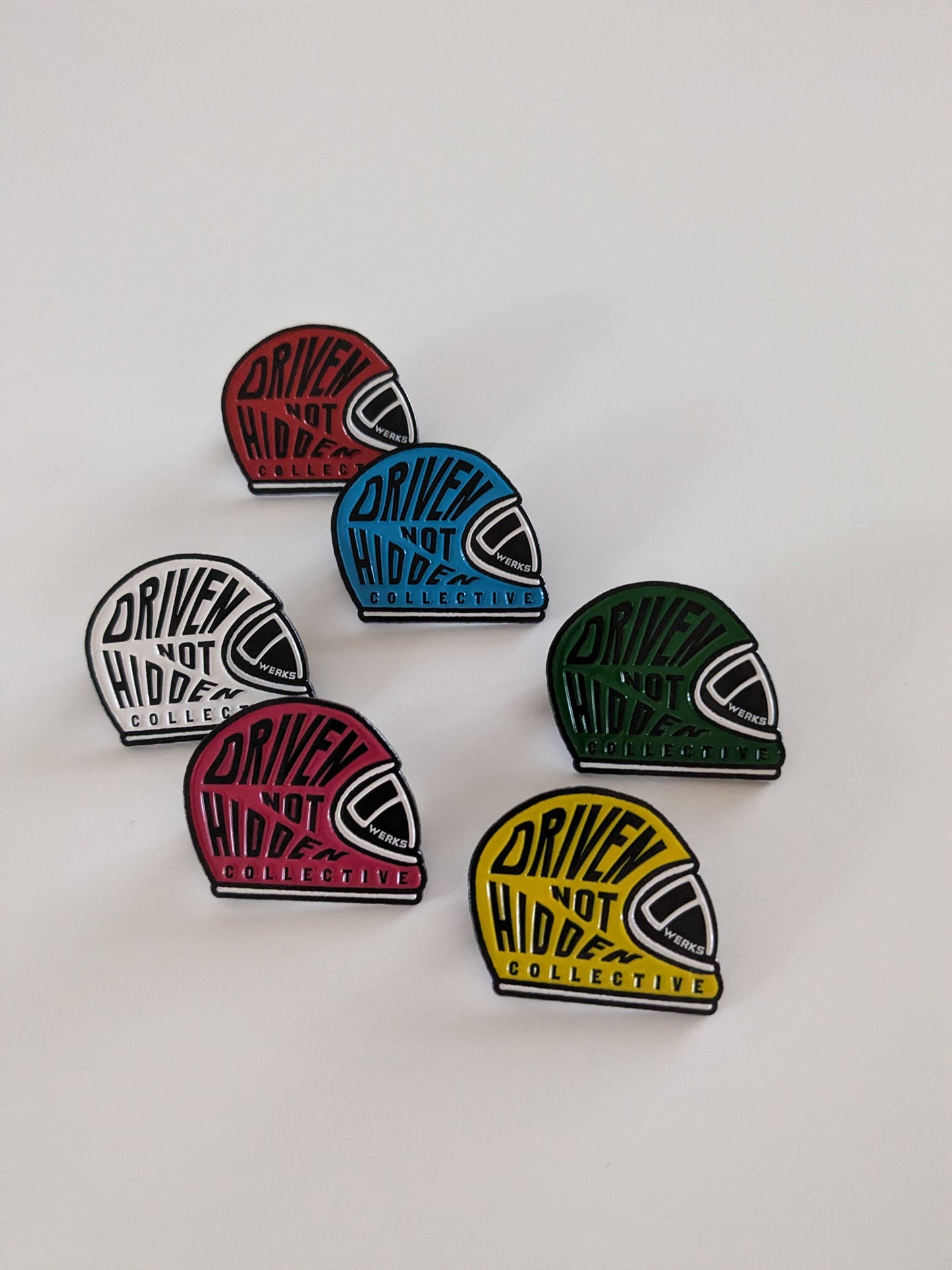 Driven Not Hidden Collective enamel pin badge